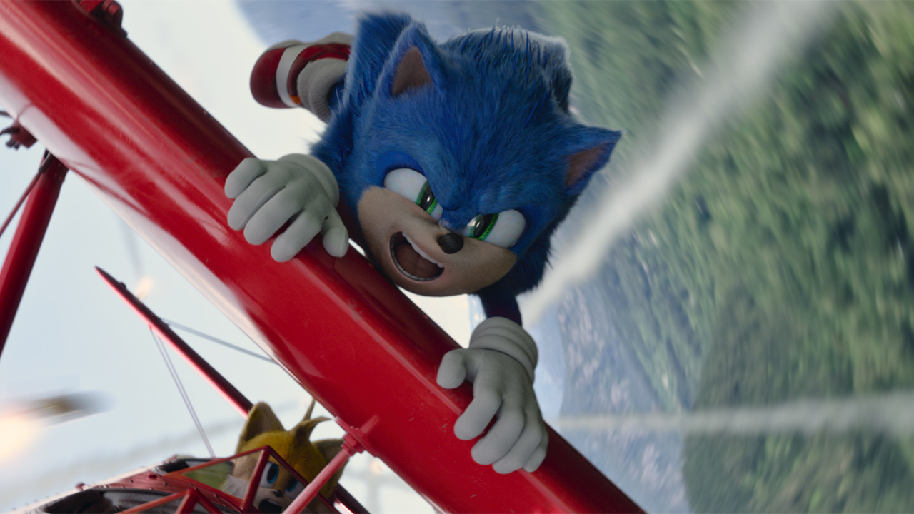 Sonic The Hedgehog flying on Tails' plane in Sonic The Hedgehog 2