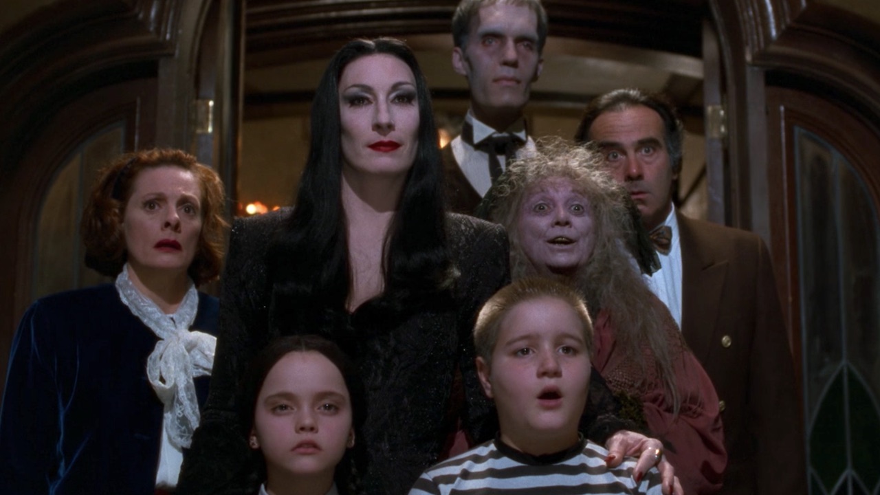 The Addams Family characters at the door.