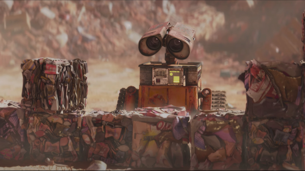 Wall-E regarde avec envie les ordures dans Wall-E