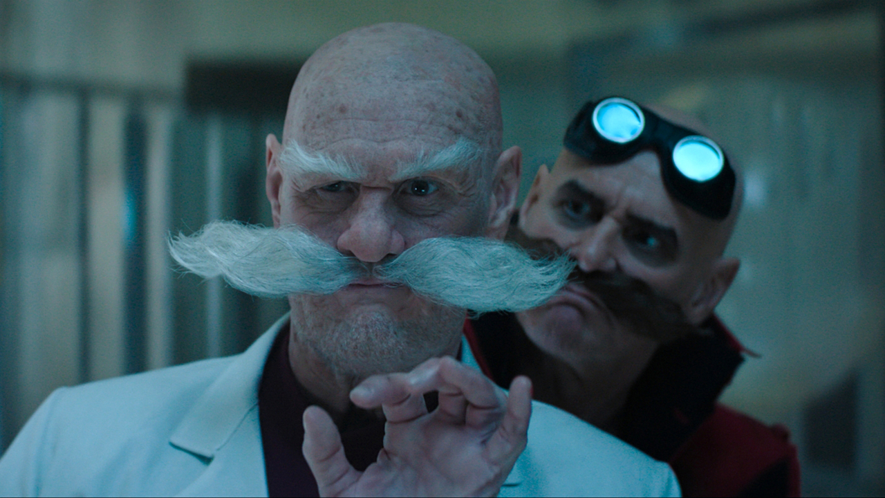 Ivo Robotnik de Jim Carrey regarde par-dessus l'épaule de Gerald Robotnik de Jim Carrey dans Sonic the Hedgehog 3.